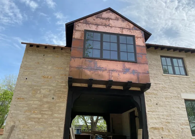 Copper metal panel facade on a stone building for Skylight Installation in Dunwoody