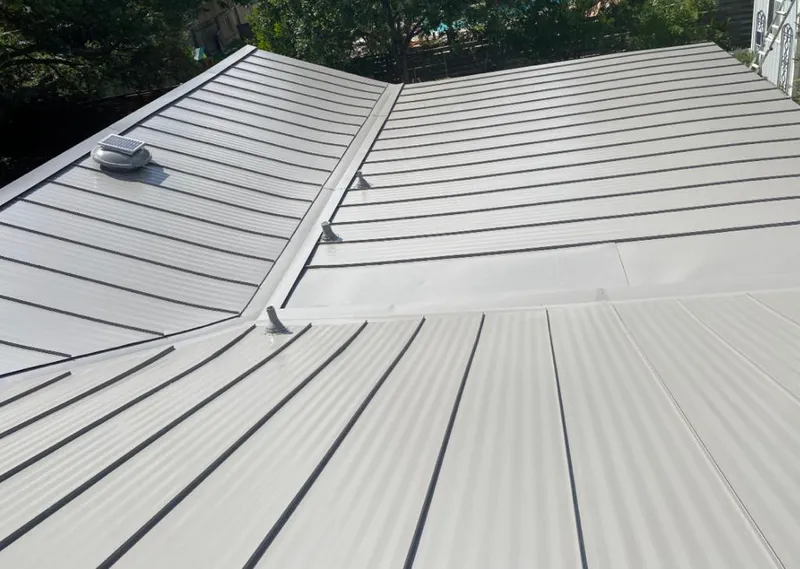 Solar attic fan installed on a metal roof for Roof Ventilation in Dunwoody